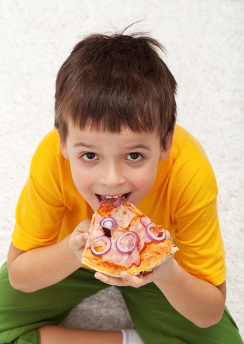 boy eating pizza